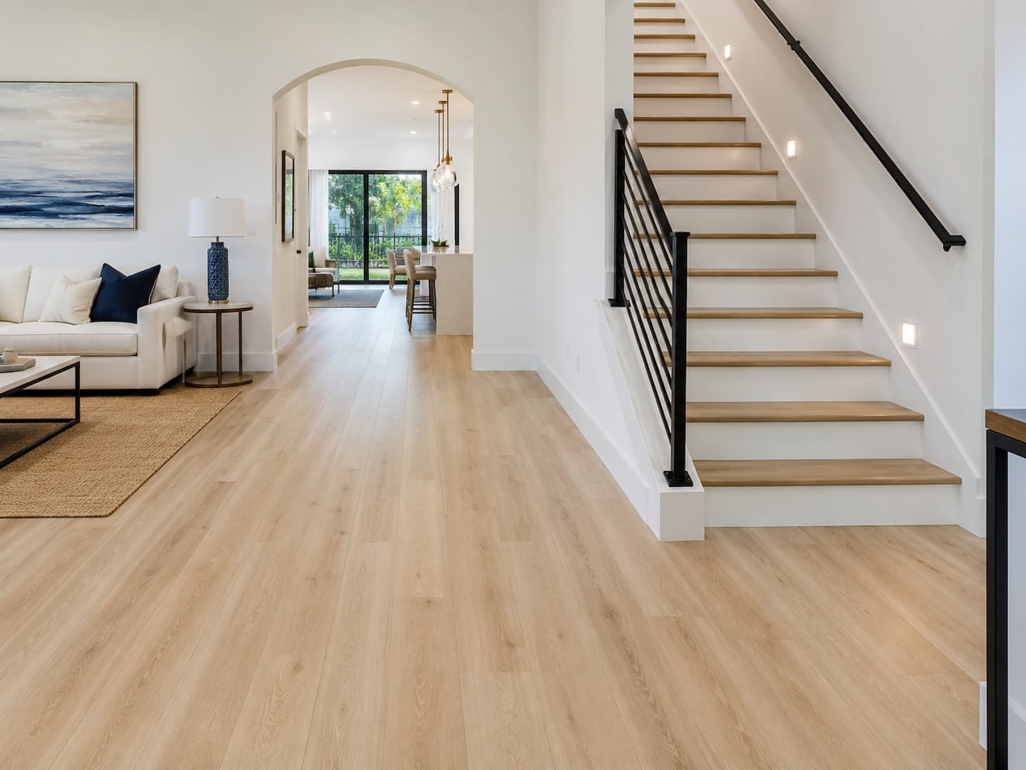 Finished luxury vinyl plank floor with stairs in a St. Petersburg Florida home by SVR FLOORS