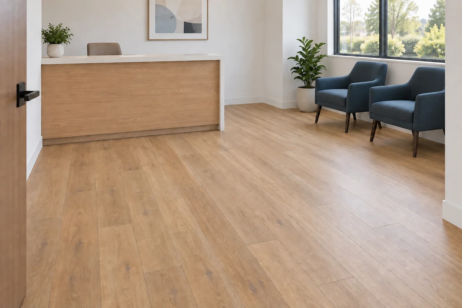 Wood-look flooring in a small office reception with simple furnishings